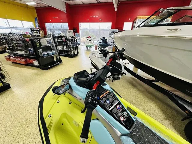 Slide: The Image of 2025 Yamaha WaveRunner JetBlaster in showroom with boats and accessories. - 8