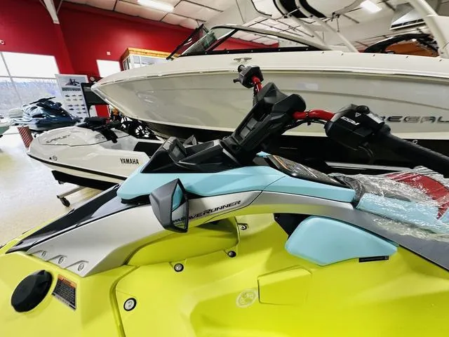 Slide: The Image of 2025 Yamaha WaveRunner JetBlaster in showroom, vibrant yellow and blue design. - 9
