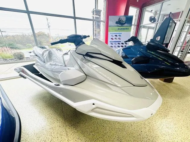 Slide: The Image of 2025 Yamaha WaveRunner VX Cruiser HO in showroom, sleek white design. - 1