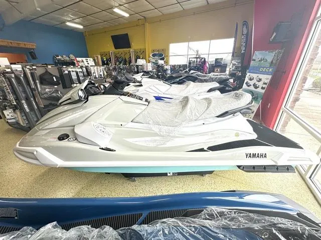 Slide: The Image of 2025 Yamaha WaveRunner VX Cruiser HO in showroom, wrapped in protective plastic. - 2