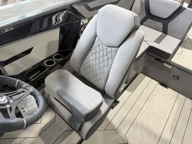 Slide: The Image of 2025 Yamaha Boats 222XE interior with modern seating and sleek design. - 17
