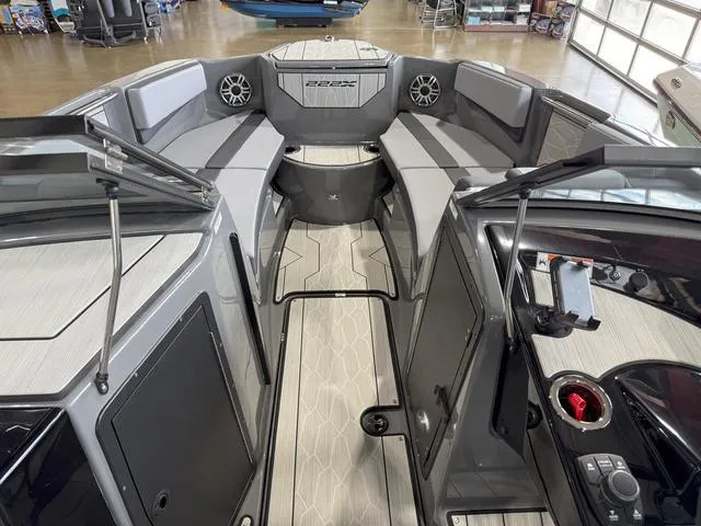 Slide: The Image of 2025 Yamaha Boats 222XE interior with sleek seating and modern design. - 19