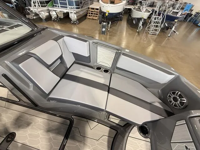 Slide: The Image of Interior seating of 2025 Yamaha Boats 222XE, featuring sleek gray and white design. - 24
