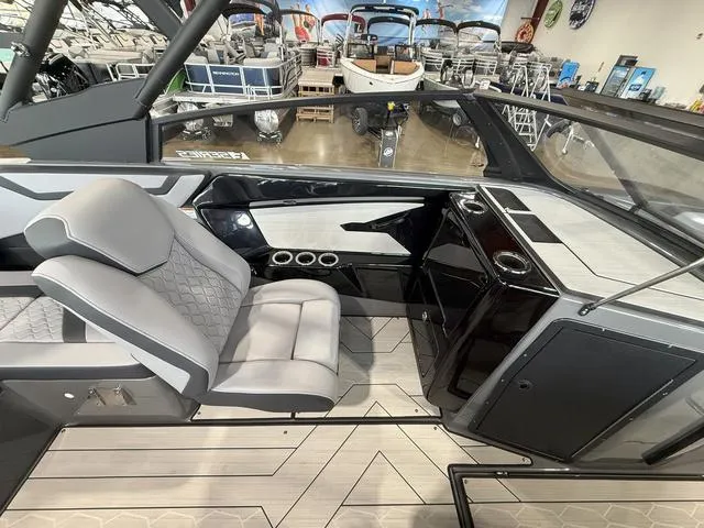 Slide: The Image of Interior of 2025 Yamaha Boats 222XE, featuring sleek seating and modern design elements. - 13