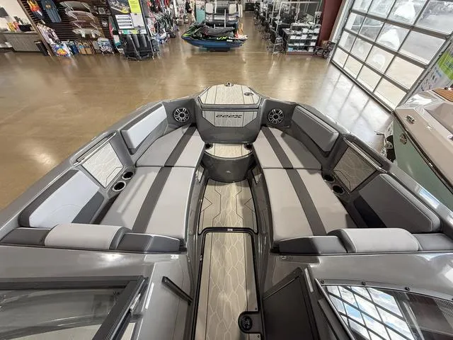 Slide: The Image of 2025 Yamaha Boats 222XE interior with spacious seating and modern design. - 21