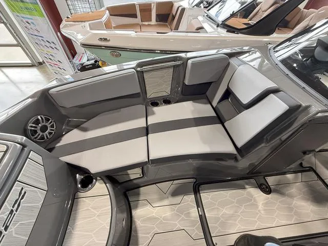 Slide: The Image of 2025 Yamaha Boats 222XE interior with gray seating and modern design. - 22