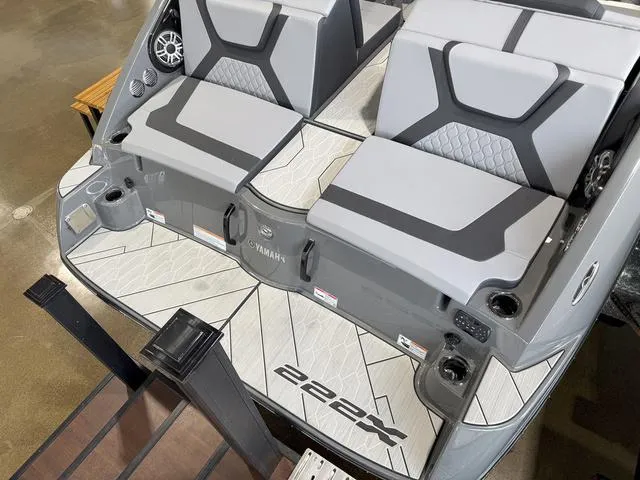 Slide: The Image of 2025 Yamaha Boats 222XE interior with gray seating and modern design. - 4