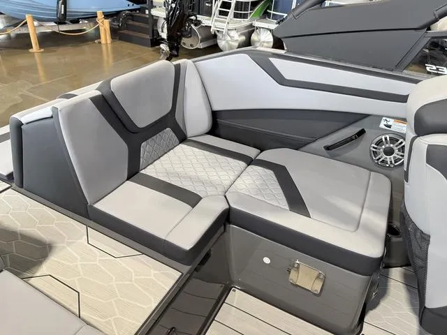 Slide: The Image of 2025 Yamaha Boats 222XE interior with modern gray seating and stylish design. - 7