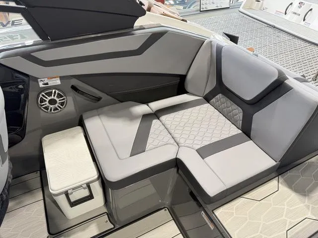 Slide: The Image of 2025 Yamaha Boats 222XE interior with sleek gray seating and modern design. - 8