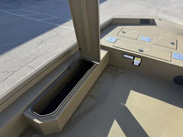 Slide: The Image of Avid 20 Rogue SC 2025 boat interior with storage compartments and livewell. - 14