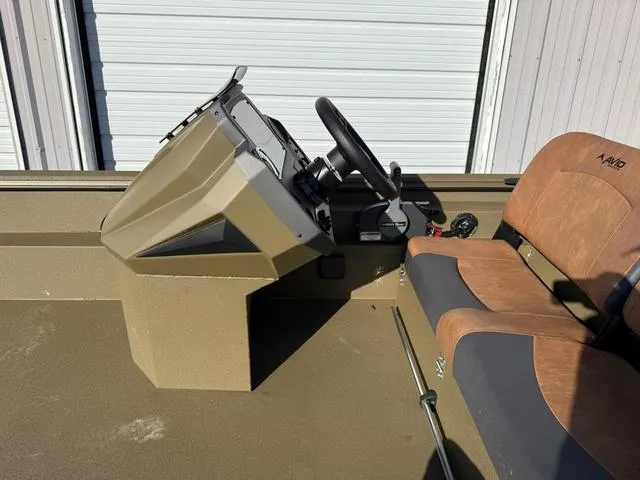 Slide: The Image of 2025 Avid 20 Rogue SC boat interior with steering console and seating. - 18