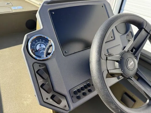 Slide: The Image of Avid 20 Rogue SC 2025 boat dashboard with steering wheel and control panel. - 19