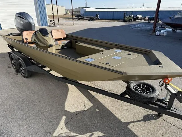 Slide: The Image of 2025 Avid 20 Rogue SC fishing boat on trailer, featuring Yamaha outboard motor. - 6