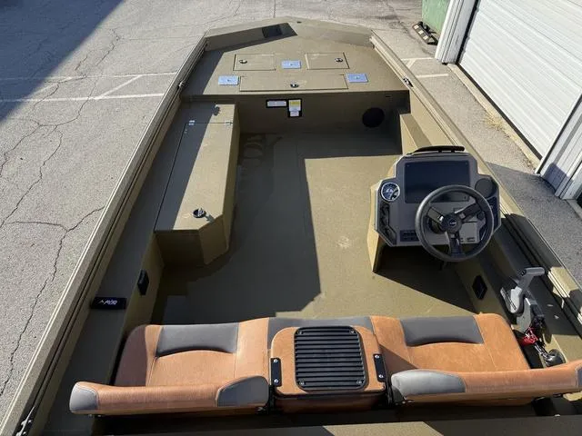 Slide: The Image of 2025 Avid 20 Rogue SC boat interior with steering console and seating. - 8