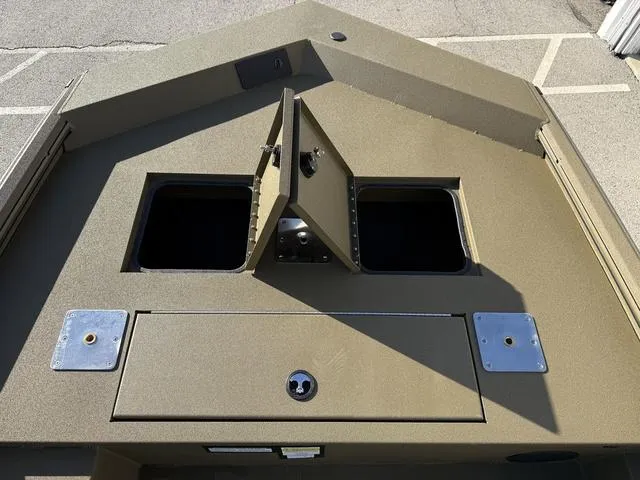 Slide: The Image of 2025 Avid 20 Rogue SC boat deck with open storage compartments. - 9