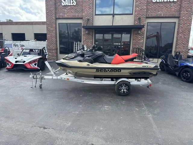 Slide: The Image of 2025 Sea-Doo Waverunner PWC RXT X 325, sleek design, red and black color scheme. - 1