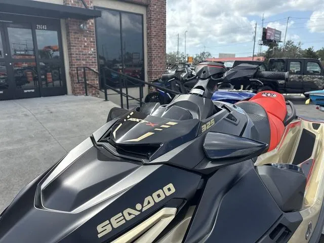Slide: The Image of 2025 Sea-Doo Waverunner PWC RXT X 325 parked outside a building. - 3