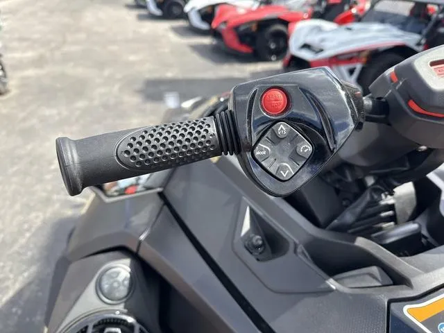 Slide: The Image of Handlebar controls of 2025 Sea-Doo Waverunner PWC RXT X 325, featuring buttons and grip. - 6