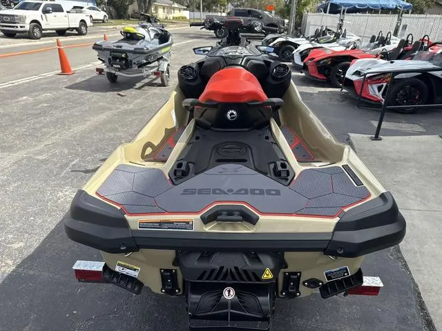 Slide: The Image of 2025 Sea-Doo Waverunner PWC RXT X 325 on display in a parking lot. - 8
