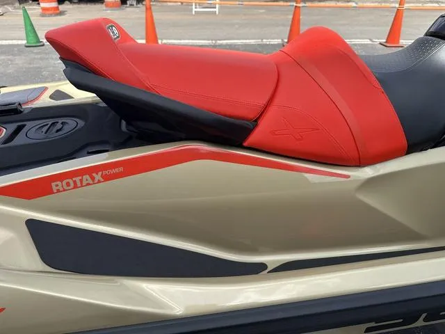 Slide: The Image of 2025 Sea-Doo Waverunner PWC RXT X 325 with red seat and Rotax power branding. - 9