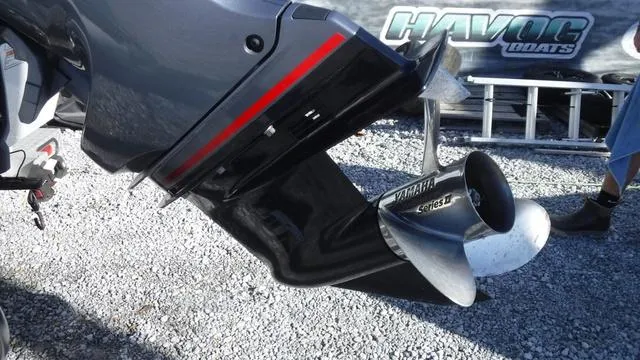 Slide: The Image of Avid 23 FS 2021 boat with Yamaha propeller on gravel surface. - 16