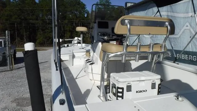 Slide: The Image of 2021 Avid 23 FS boat with seating and Igloo cooler on deck. - 18