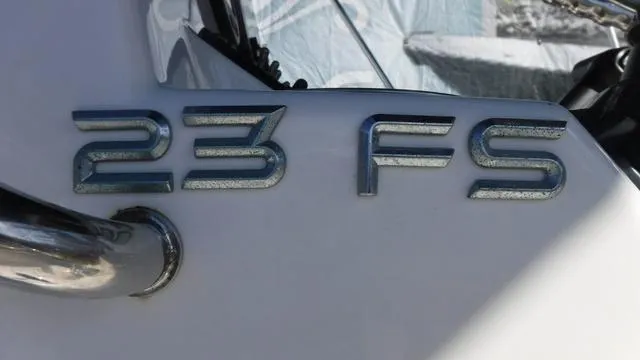 Slide: The Image of Avid 23 FS 2021 boat model emblem on white surface. - 20