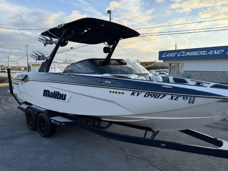 Slide: The Image of 2021 Malibu 25 LSV boat on trailer at Lake Cumberland dealership. - 15