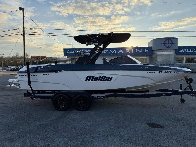 Slide: The Image of 2021 Malibu 25 LSV boat parked at Lakeland Marine dealership. - 20