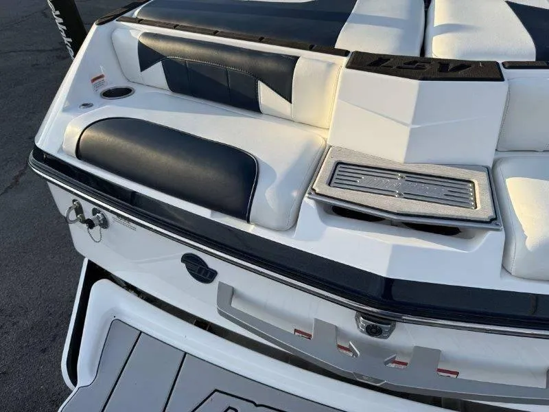 Slide: The Image of 2021 Malibu 25 LSV boat interior with sleek black and white seating. - 37