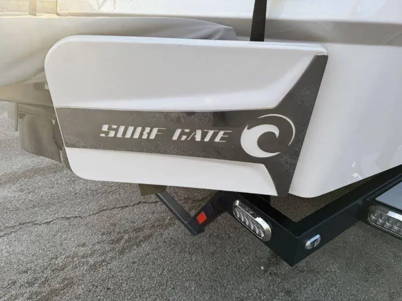 Slide: The Image of 2021 Malibu 25 LSV Surf Gate feature on boat's rear. - 41