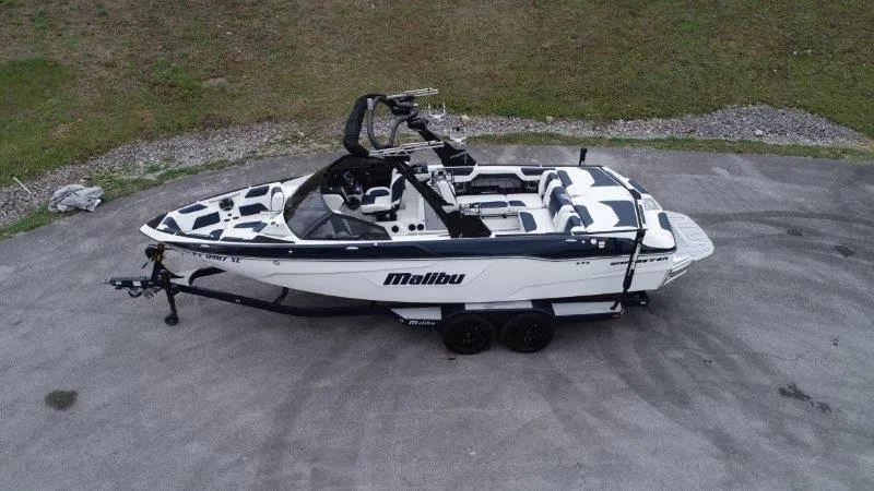 Slide: The Image of 2021 Malibu 25 LSV boat on trailer, aerial view. - 6