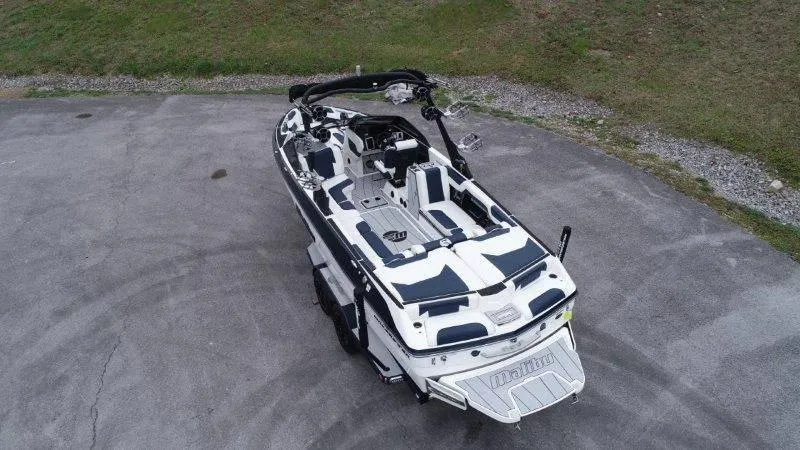 Slide: The Image of 2021 Malibu 25 LSV boat on concrete, aerial view. - 7