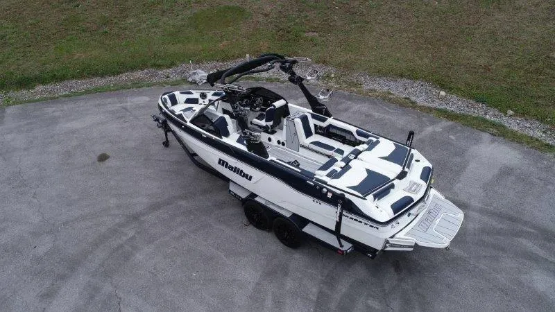 Slide: The Image of 2021 Malibu 25 LSV boat on trailer, aerial view. - 8