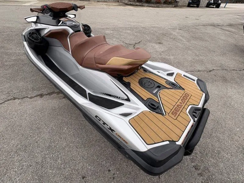Slide: The Image of 2018 Sea-Doo GTX Limited 230 Sound jet ski with brown seating and sleek design. - 11