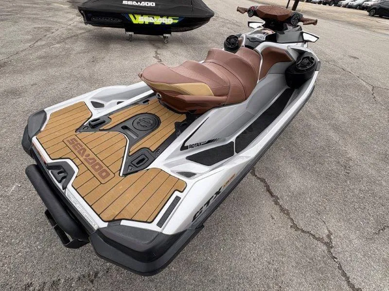Slide: The Image of 2018 Sea-Doo GTX Limited 230 Sound jet ski with brown seating and sleek design. - 14