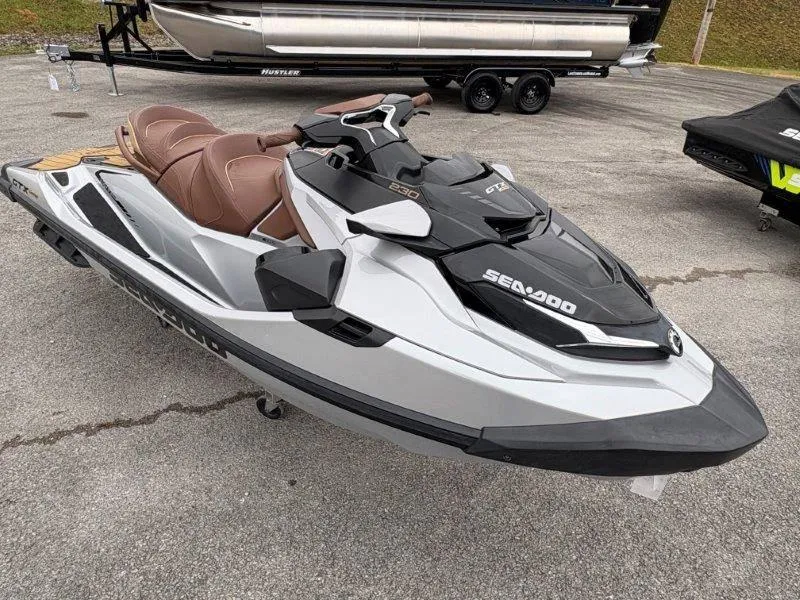 Slide: The Image of 2018 Sea-Doo GTX Limited 230 Sound jet ski, parked on pavement. - 33