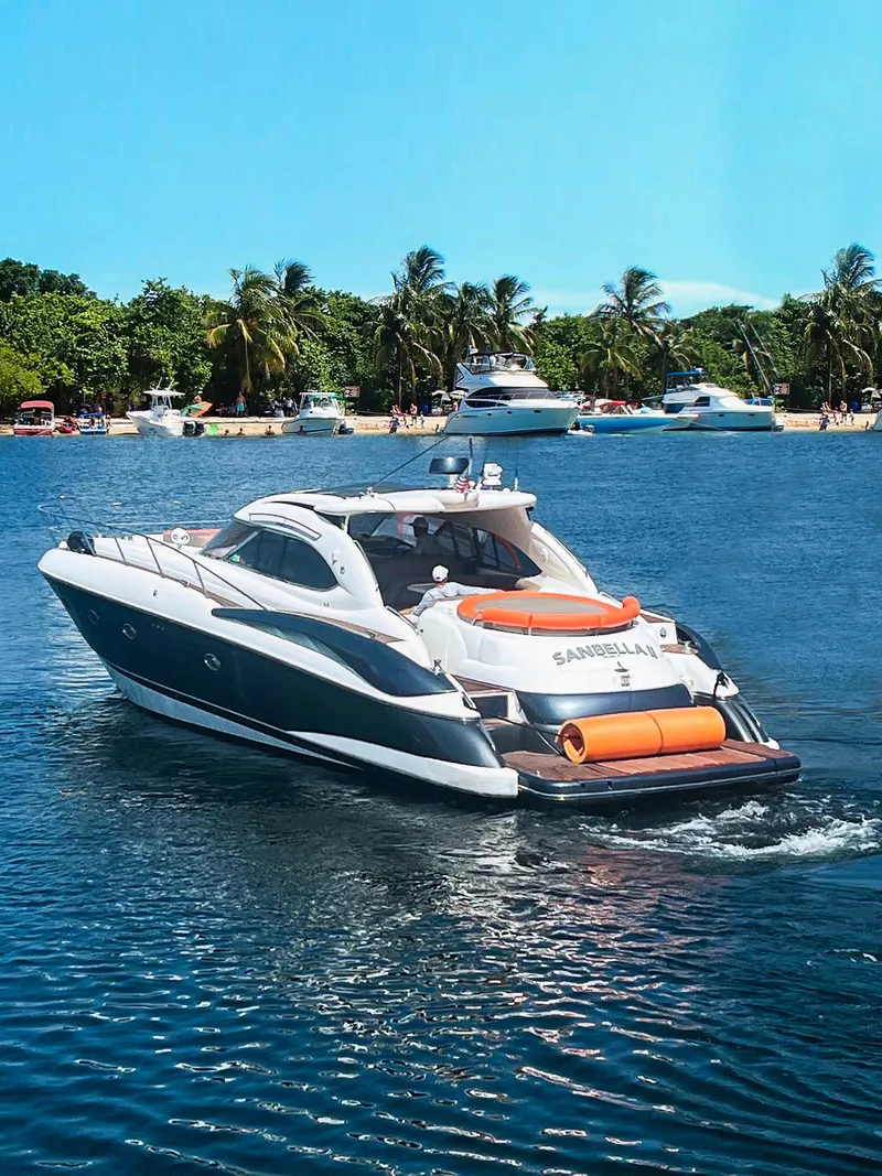 Slide: The Image of Luxurious interior of 2003 Sunseeker Predator 60 yacht with polished wood and elegant seating. - 2