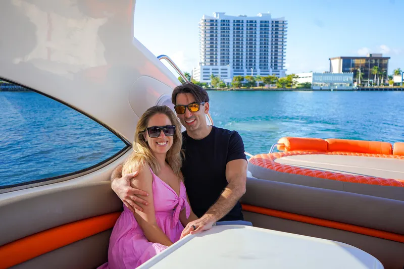 Slide: The Image of Couple enjoying a sunny day on a 2003 Sunseeker Predator 60 yacht. - 4