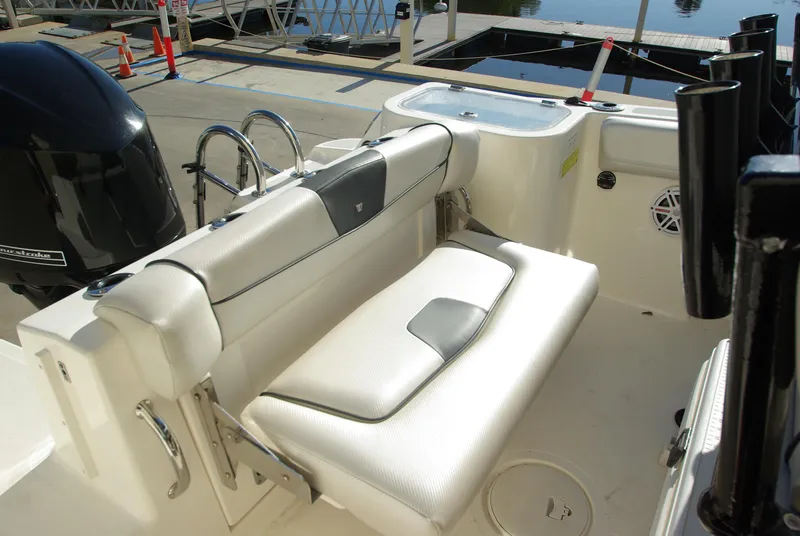Slide: The Image of 2018 Wellcraft 222 Scarab Offshore boat interior with seating and motor. - 20