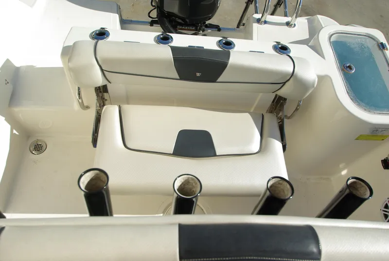 Slide: The Image of 2018 Wellcraft 222 Scarab Offshore boat interior with seating and rod holders. - 21
