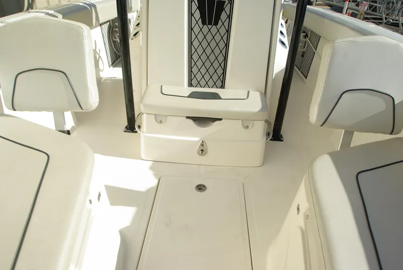 Slide: The Image of 2018 Wellcraft 222 Scarab Offshore boat interior with seating and storage. - 23