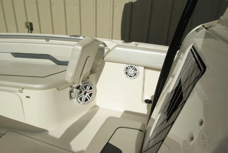Slide: The Image of 2018 Wellcraft 222 Scarab Offshore boat interior with seating and speakers. - 28