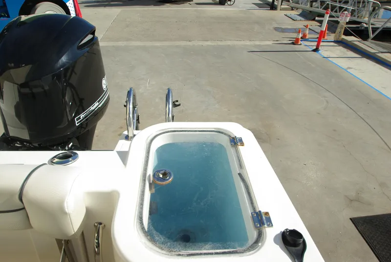 Slide: The Image of 2018 Wellcraft 222 Scarab Offshore boat with livewell and outboard motor. - 31