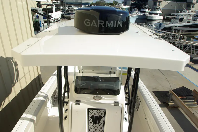 Slide: The Image of 2018 Wellcraft 222 Scarab Offshore boat with Garmin equipment, docked at marina. - 33