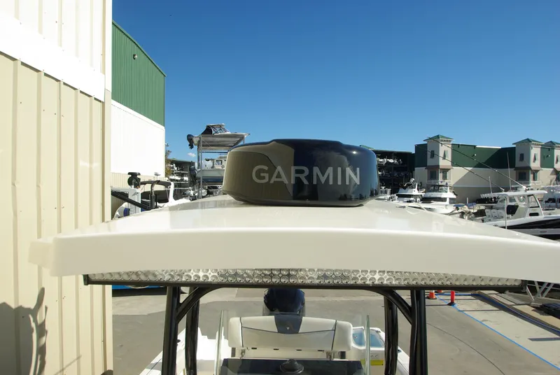 Slide: The Image of 2018 Wellcraft 222 Scarab Offshore with Garmin radar, docked at a marina. - 7