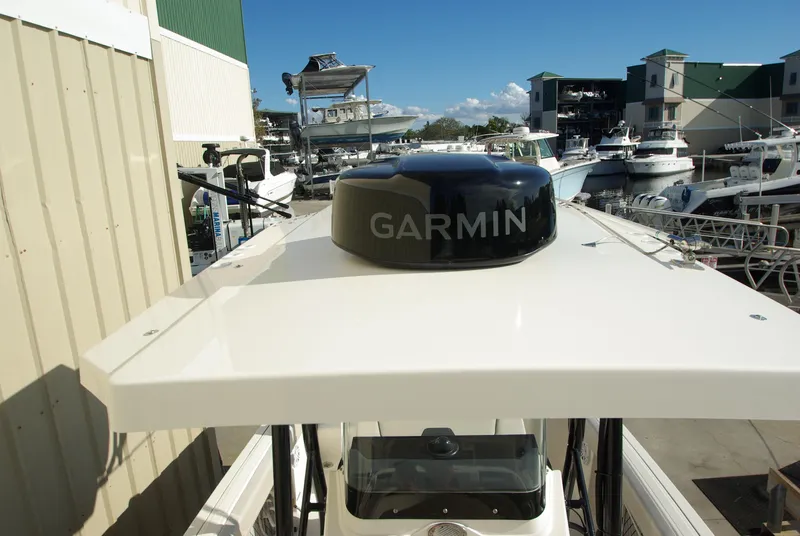 Slide: The Image of 2018 Wellcraft 222 Scarab Offshore with Garmin radar, docked at a marina. - 8