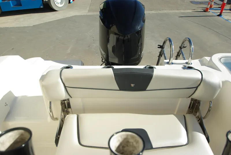 Slide: The Image of 2018 Wellcraft 222 Scarab Offshore boat interior with outboard motor and seating. - 25