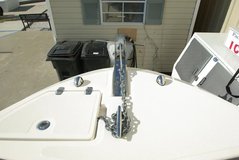 Slide: The Image of 2018 Wellcraft 222 Scarab Offshore boat bow with anchor chain and deck hatches. - 30