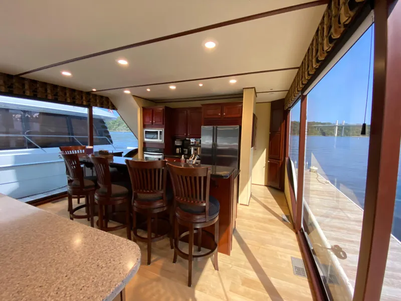 Slide: The Image of Luxurious interior of a 2005 Skipperliner Millenium yacht with plush seating and large windows. - 10